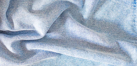 crumpled coarse denim light blue fabric, texture of matter, horizontalの写真素材