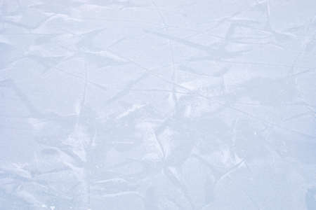 abstract light ice surface with prints sprinkled with snow, horizontalの写真素材