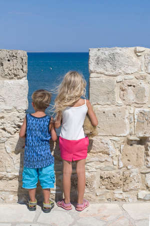 boy and girl looking into the distanceの写真素材