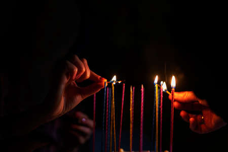 birthday cake with burning candles for birthday, holiday partyの写真素材