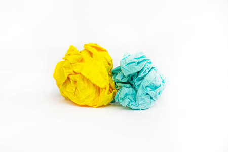 abstract background with yellow crumpled paper with blue crumpled piece of paper, horizontalの写真素材