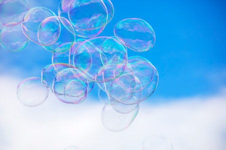 soap bubbles against the blue sky, horizontal holiday,の写真素材