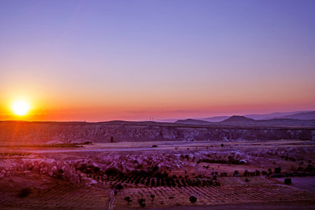 huge hot air balloons with and without flame before flying with bizarre mountain silhouettes in the Cappadocia valley in the early morning.の写真素材