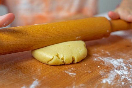 child makes a christmas star from homemade christmas dough for the holiday. Flat lay, top viewの写真素材