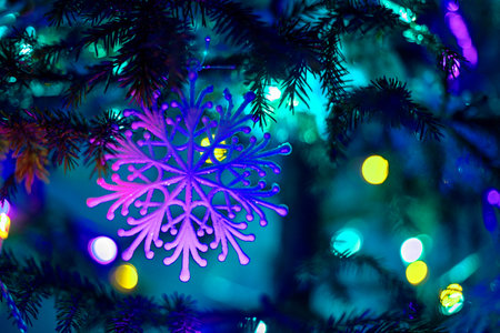 blue lilac snowflake on a Christmas tree at night blue lighting with lanterns, horizontal format