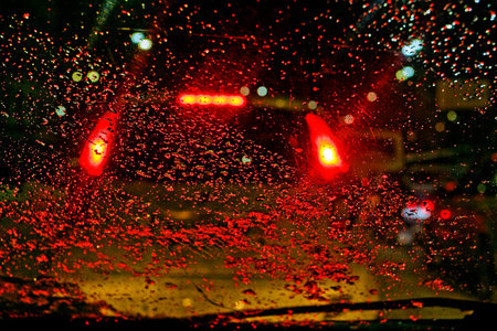 Waterdrops , Raindrops On Car Window With Bokeh Background At Night In The City , Selective Focus