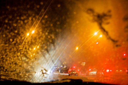Driving a car in traffic jam in bad weather conditionsの写真素材