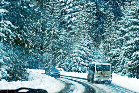 driving a car on a snowy road in winter