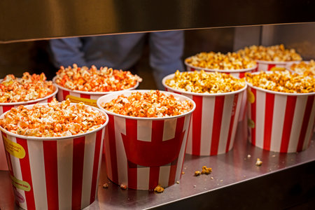 packaging with different flavors of popcorn for watching a movie close-up. family holidayの写真素材