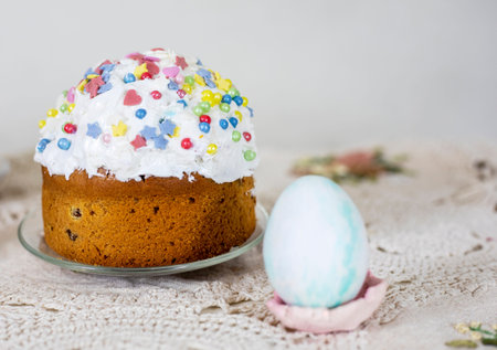 Easter cakes with Easter eggs on a vintage tablecloth, preparation for the holiday.