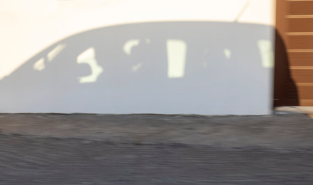 shadow from a driving car on the wall, abstraction, horizontalの写真素材