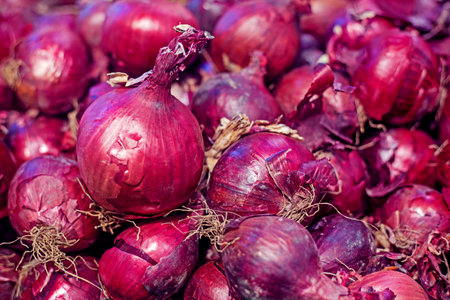 background of ripe red onions close-up. Organic onion top view. food background.の写真素材