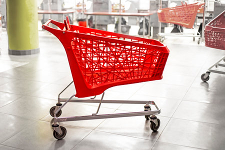 empty red carts for groceries in the mall. family shoppingの写真素材