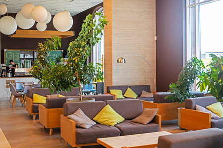 stylish modern office interior with green plants in the lobby with a bar and reception.の写真素材