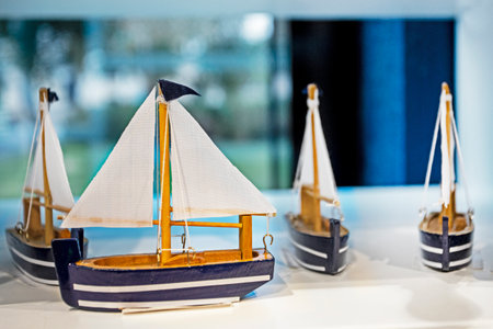 ship models with sailboats on a blue backgroundの写真素材