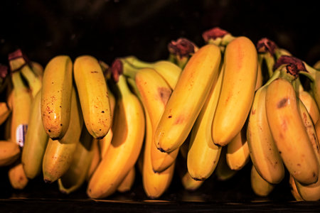 ripe bananas on display in a supermarketの写真素材