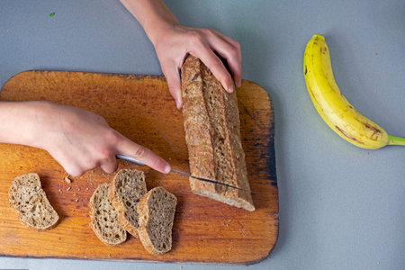 cut banana bread on a cutting board in the kitchen.