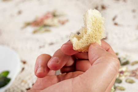 hold in your hand a small piece of white sourdough bread made from durum wheat