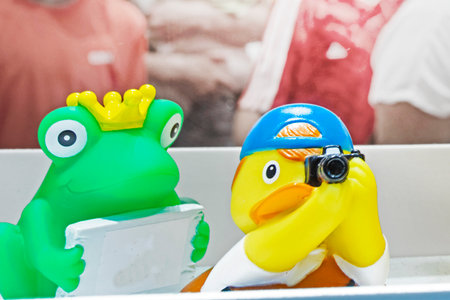 cute rubber toy frog and duck on display in a supermarketの写真素材