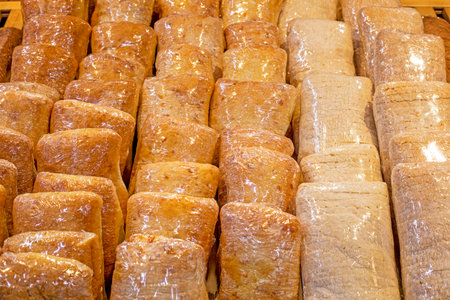 Yeast-free chabata bread made from durum wheat on the store counter. fresh baked goodsの写真素材