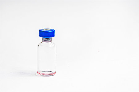 glass bottles on a white background. Routine vaccinations for animals and people