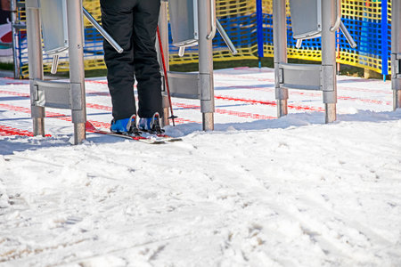 skier entering the ski lift in the morning. Active family vacationの写真素材