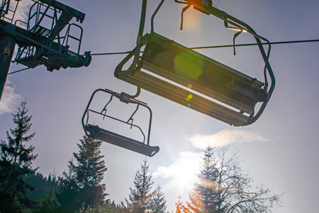 ski lift without people on a sunny day on the slope. Leisure. school break