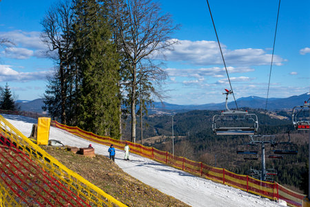 track for beginner skiers illuminated by the sun. Active family vacation. School holidaysの写真素材