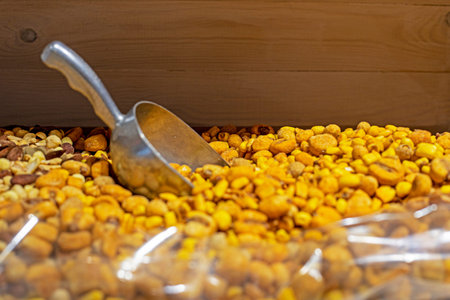 salted nuts and peanuts by weight in the supermarket. vegan food