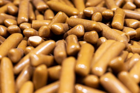 background made of milk chocolate coated jelly candiesの写真素材