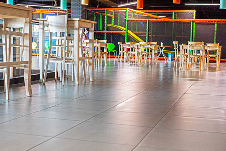 bar tables and tables in the interior near the cinema. Modern interior