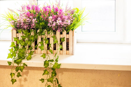 flowers on the sill decorative decorations for the interiorの写真素材