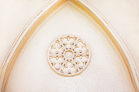 decorative architectural round element rosette with a pattern on a light background