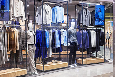 modern stylish men's and women's clothing on mannequinsの写真素材