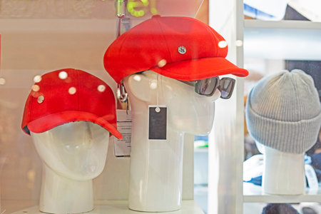 stylish women's red caps on mannequins. fashion and styleの写真素材