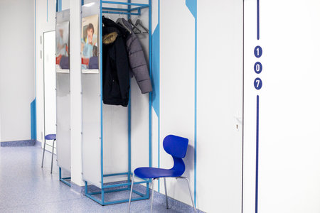 hangers for patients' clothes in front of the doctor's doorの写真素材