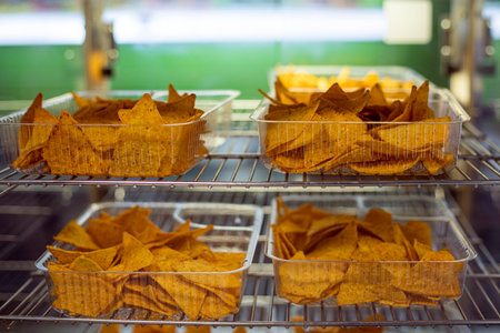 chips with different flavors in disposable plastic containersの写真素材