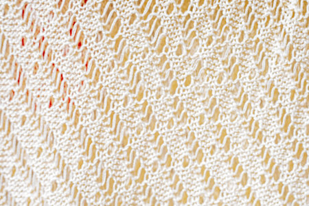 abstract light background of lace knitted fabric. Handmade. Authenticity