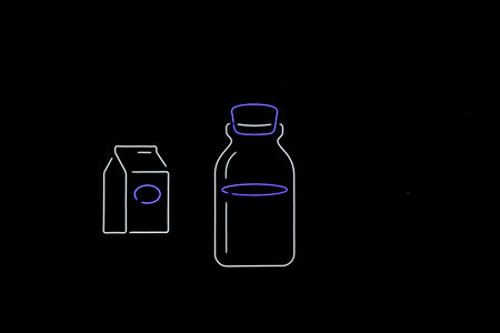 dairy product packaging on a dark background with fluorescent outlineの写真素材