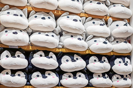 cute soft toy cats with ears on the counter in the supermarketの写真素材