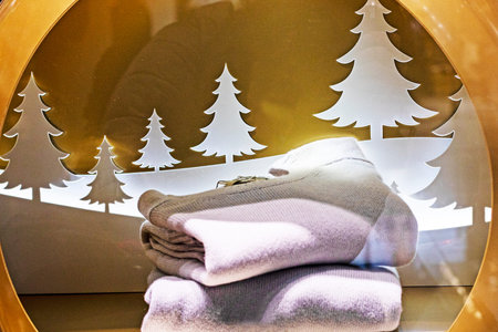 stylish bed linen and towels against the backdrop of decorative Christmas decorationsの写真素材