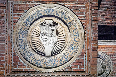 round beautiful italian bas-relief with symbolsの写真素材
