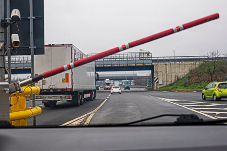 barrier at the entrance to a toll road for cars and trucks in Europe. traveling by carの写真素材
