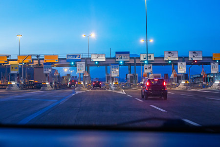 night toll road before dawn with illuminated tunnel and speed limit. Driver safety and comfort
