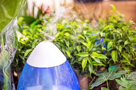 air dispenser for sprinkling water on plants and flowers in a greenhouse