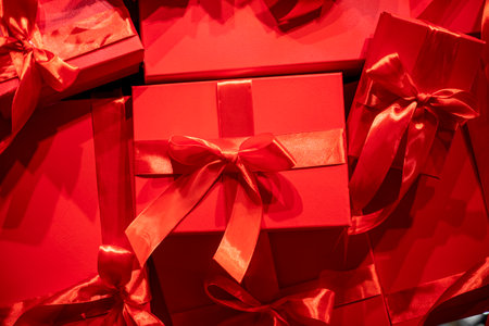 background of red gift wrapping tied with ribbons. Boxing Day. Mother's Day, Valentine's Day. Father's Day. Relationship and intimacyの写真素材