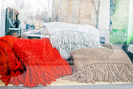 huge warm woolen scarves in a shop window