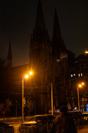 gothic church illuminated by night lanterns in the evening.の写真素材