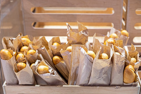 fresh grain wheat loaves packed in a wooden containerの写真素材