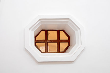 hexagonal small window in a bright interiorの写真素材